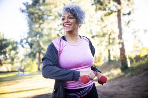 A person jogging outdoors, promoting physical activity and reduce risk of breast cancer
