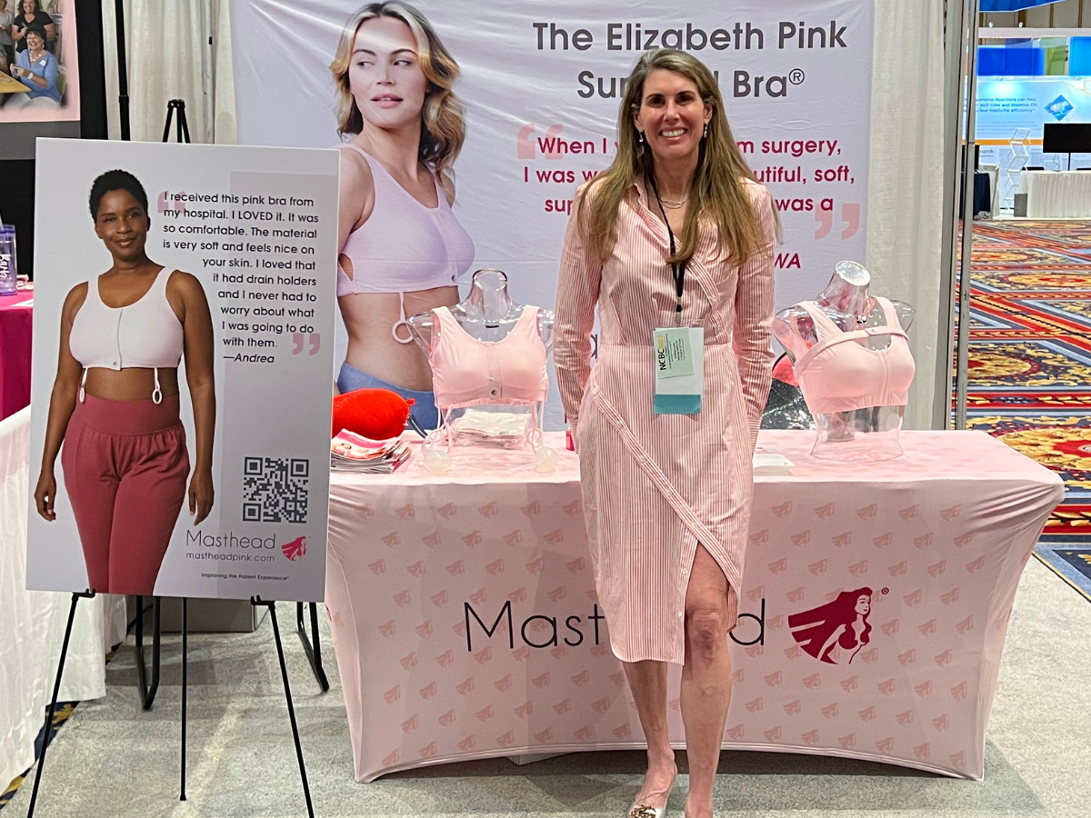 Masthead Elizabeth Pink Surgical Bra® on display at trade show, providing comfort and support